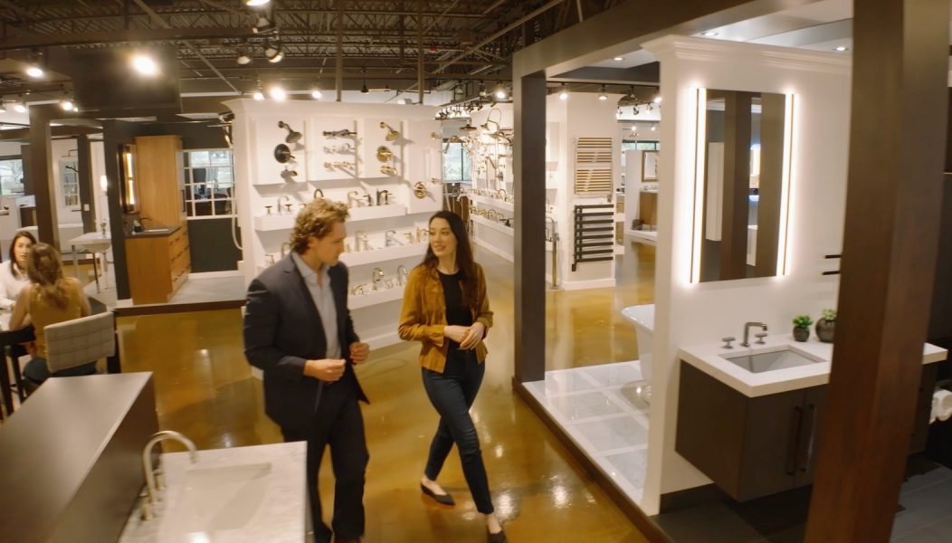 Design consultant helping customer in Banner Plumbing kitchen and bath showroom